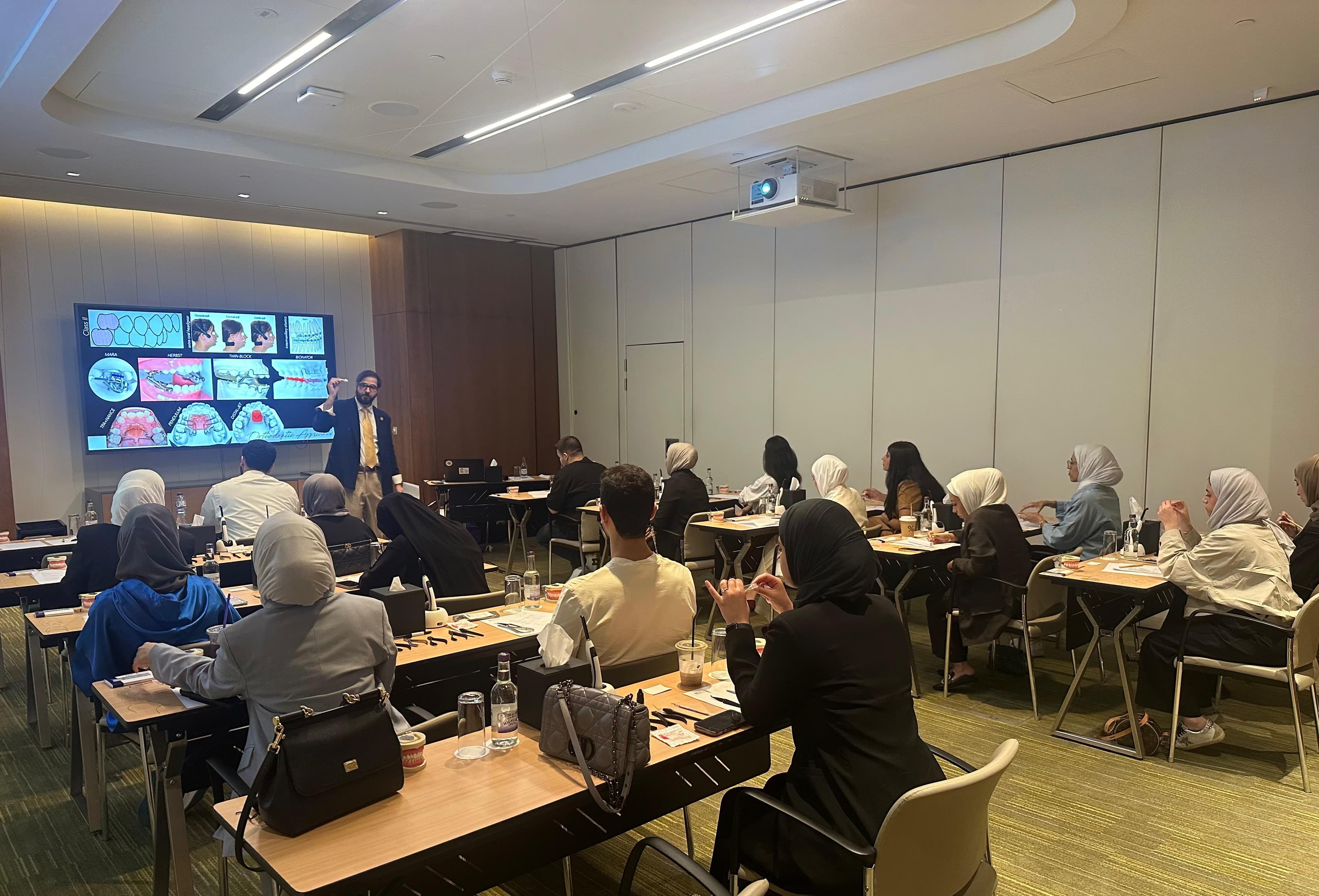 Dr. Qali during a clinical education session